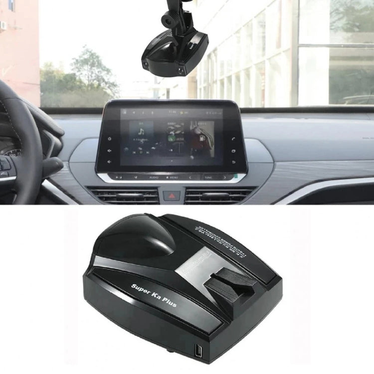 Radar detector suction-mounted on car dashboard with black control housing