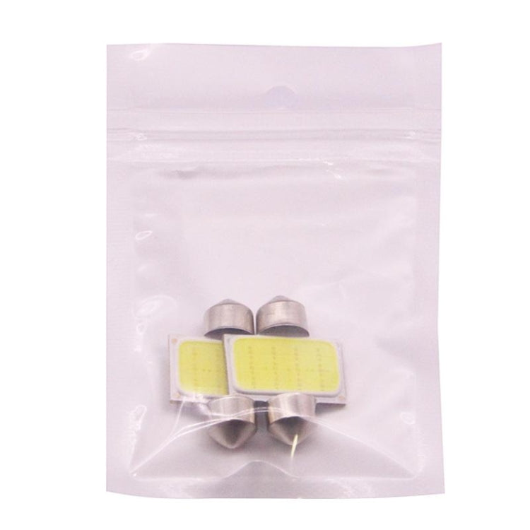 Two 31mm COB LED license plate reading lights in a clear plastic bag