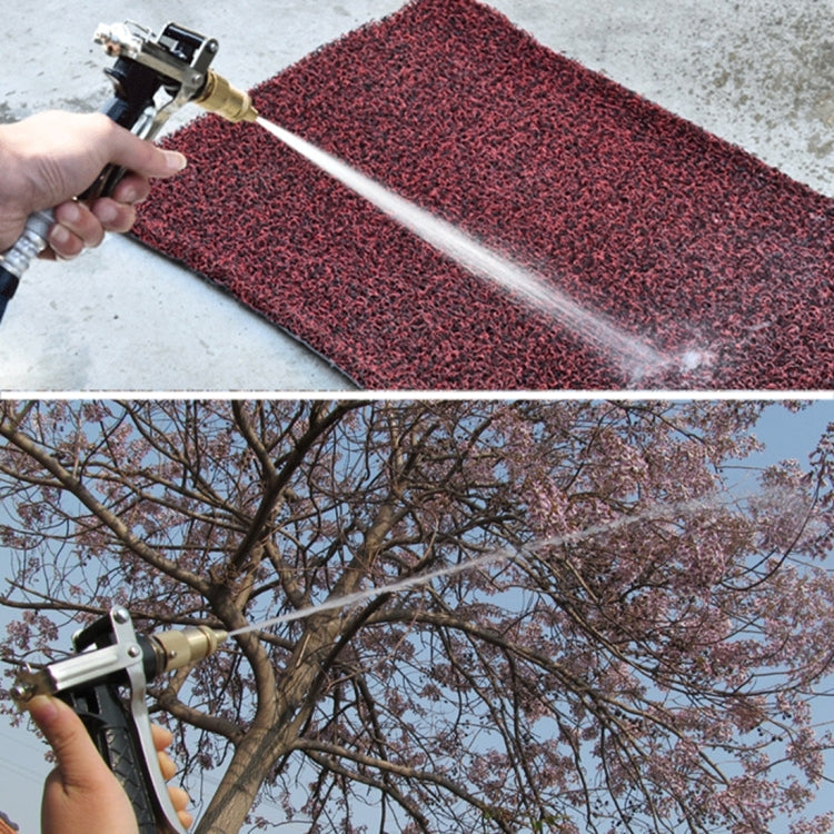 Car wash water gun spraying white water stream; black grip with copper and brass fittings