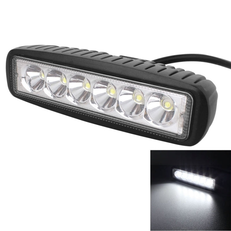 Black LED light bar with six lens bulbs and clear cover, illuminated beam