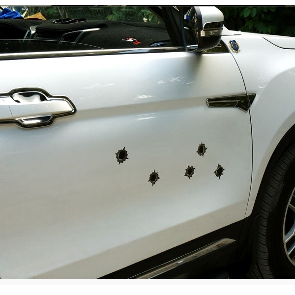 Six brown starburst bullet-hole car decals on a car door