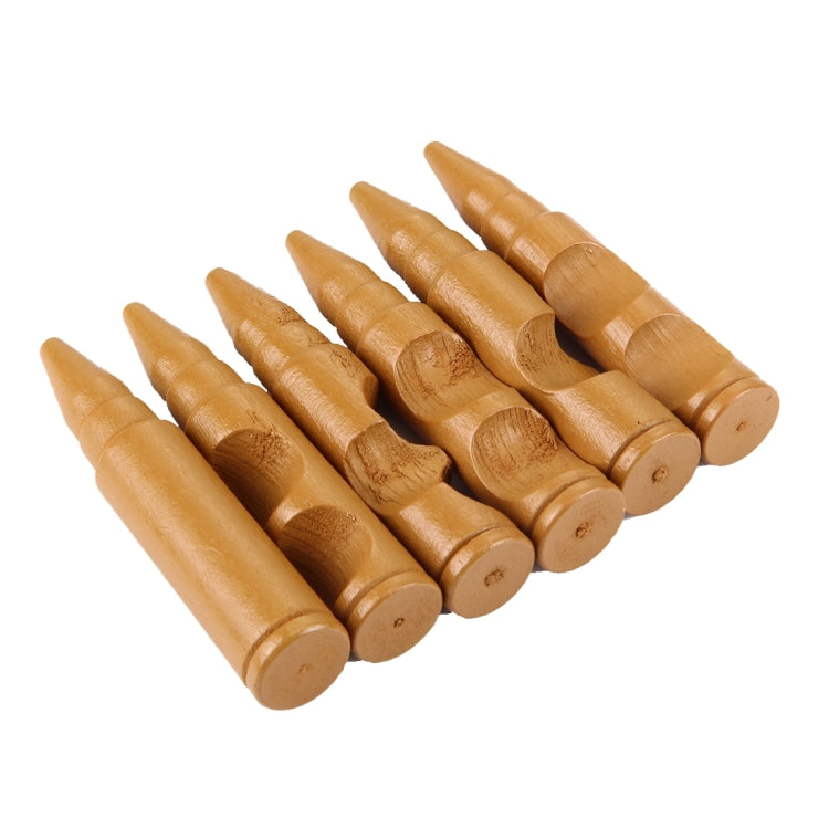 Wooden bullet-shaped pegs for a locking puzzle toy, shown in a row