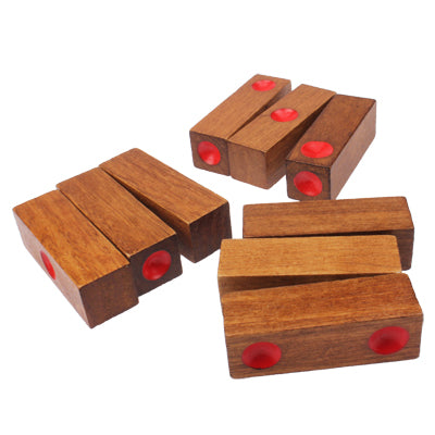 Wooden dice pile-up puzzle pieces, separate blocks with red pips on faces.