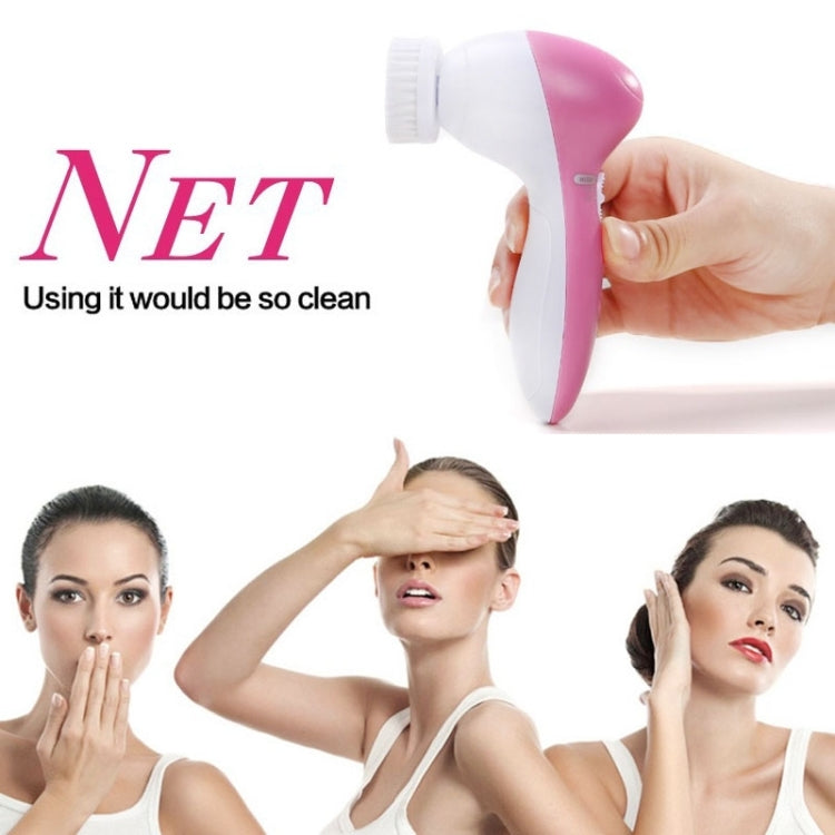 Pink and white handheld facial cleansing brush massager with bristle head