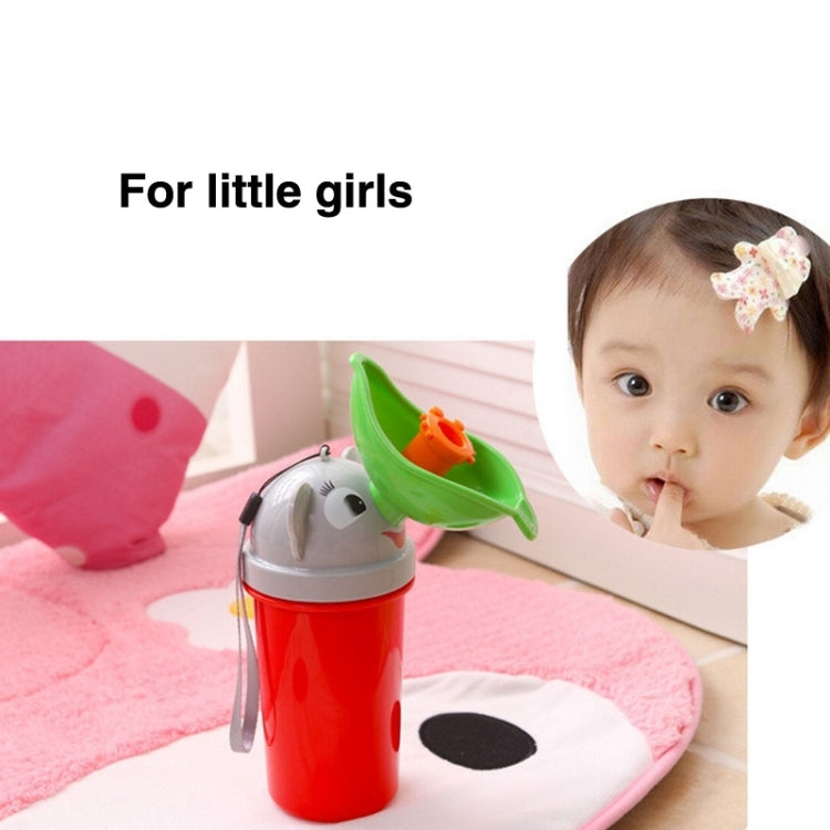 Portable children's urinal bottle with green funnel and red container near a child