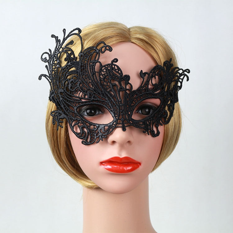 Black lace eye mask on a mannequin with ornate Venetian filigree around the eyes.