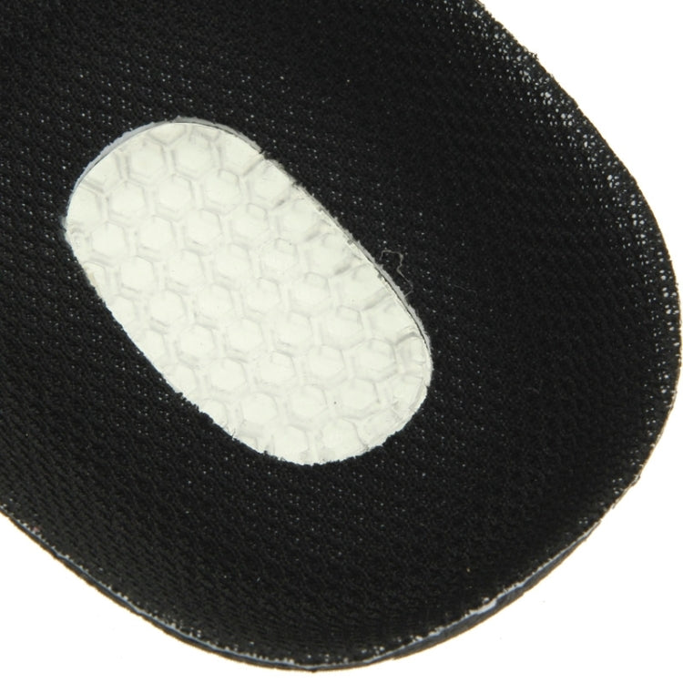 Close-up of white textured underside pad on a black orthotic insole
