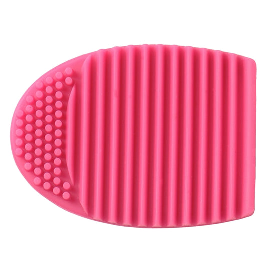 Pink silicone brush cleaning pad with ridges and dot texture