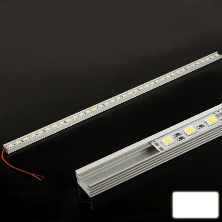 Warm white LED strip light with aluminum heat sink, red wire connection on side