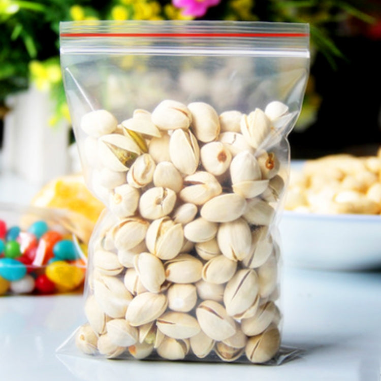 Clear self-adhesive plastic pouch with red seal stripe, filled with light nuts