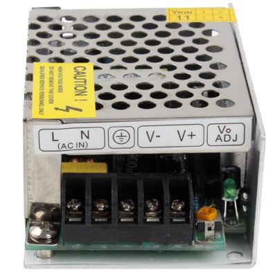 Regulated switching power supply close-up showing AC IN and V-/V+ terminals