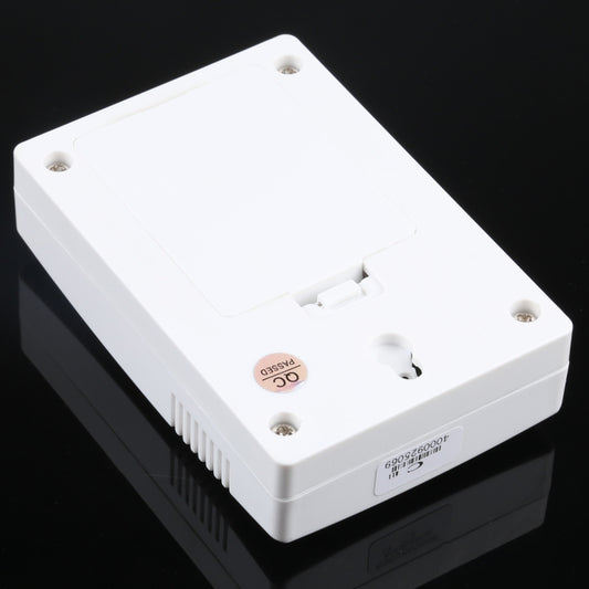 VOYE wireless doorbell remote with battery compartment and screws on white casing