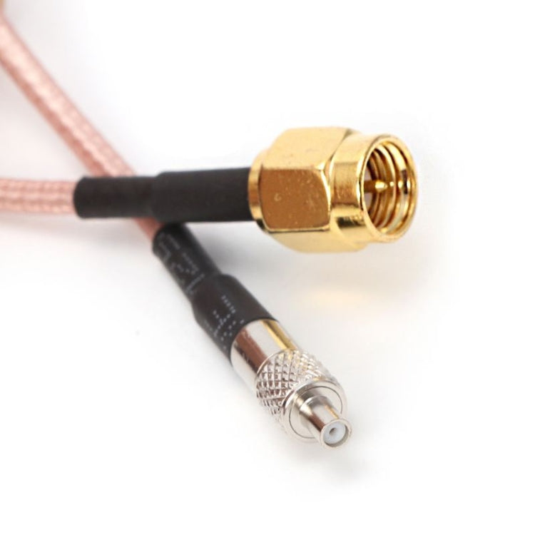 SMA male connector and TS9 plug on coax extension, showing gold and silver ends