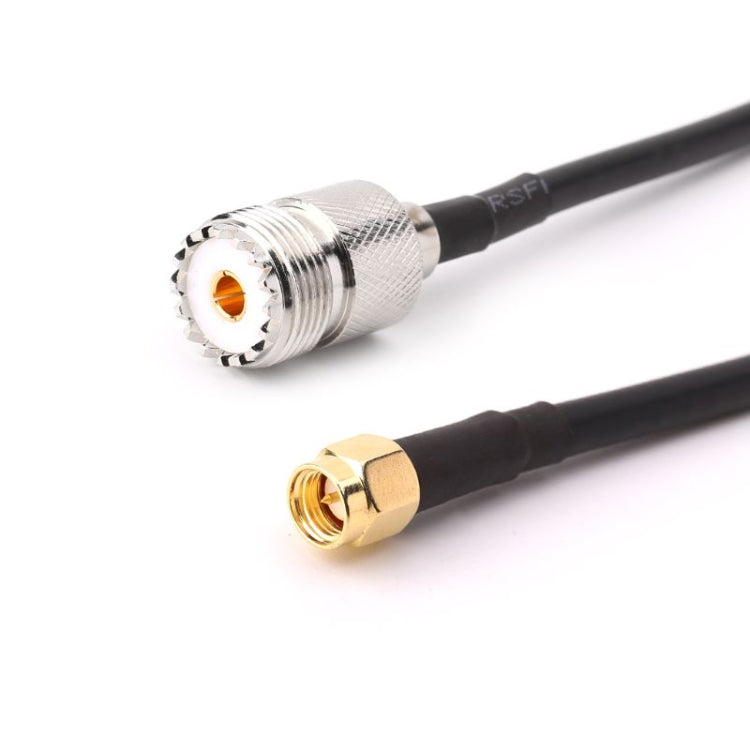 RG58 UHF female to SMA male coax cable, 50cm, close-up: silver UHF female and gold SMA male