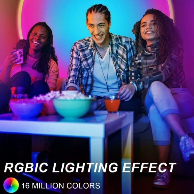 RGB sunset projector lamp creating vivid blue and purple lighting around a tabletop