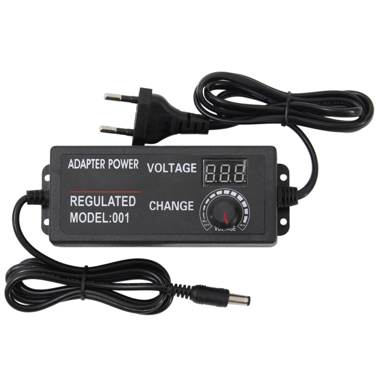 Compact power adapter module with digital voltage display, regulated output, and cables
