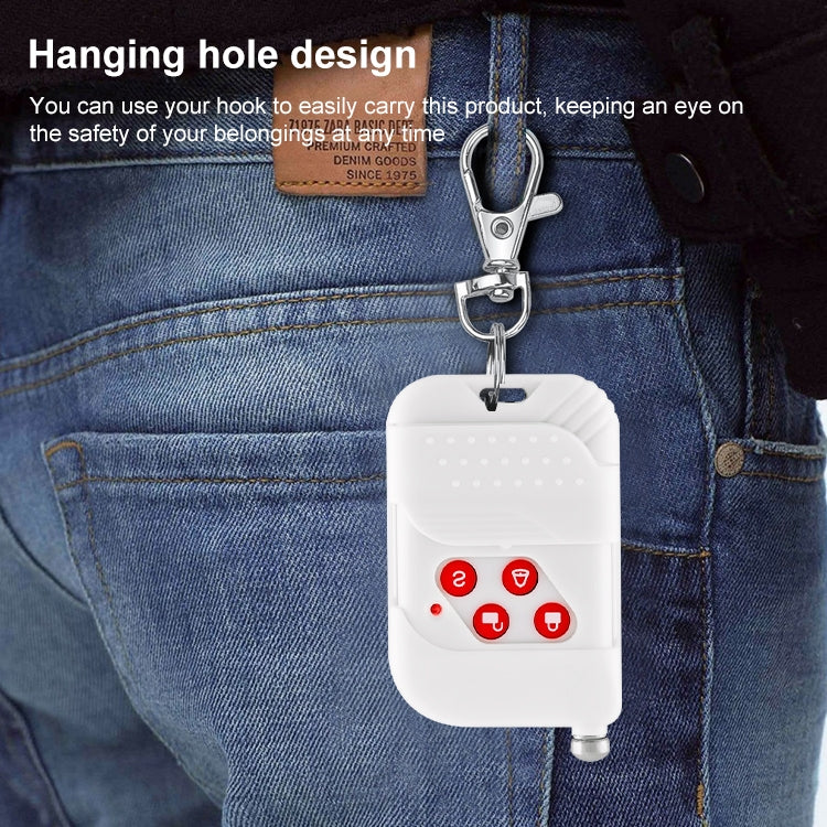 White key fob remote hanging on jeans with metal key ring and red buttons