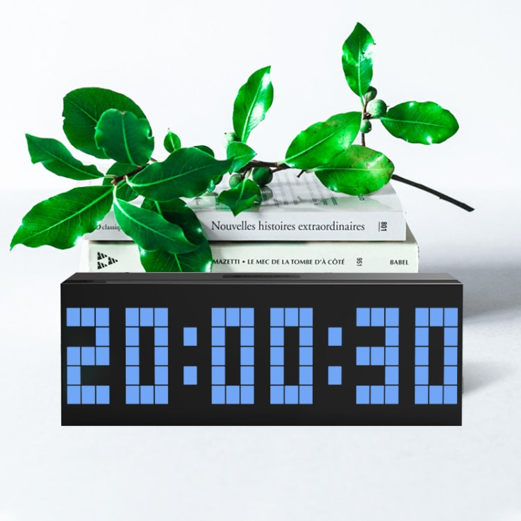 Digital LED desk alarm clock with green segmented time display on black face
