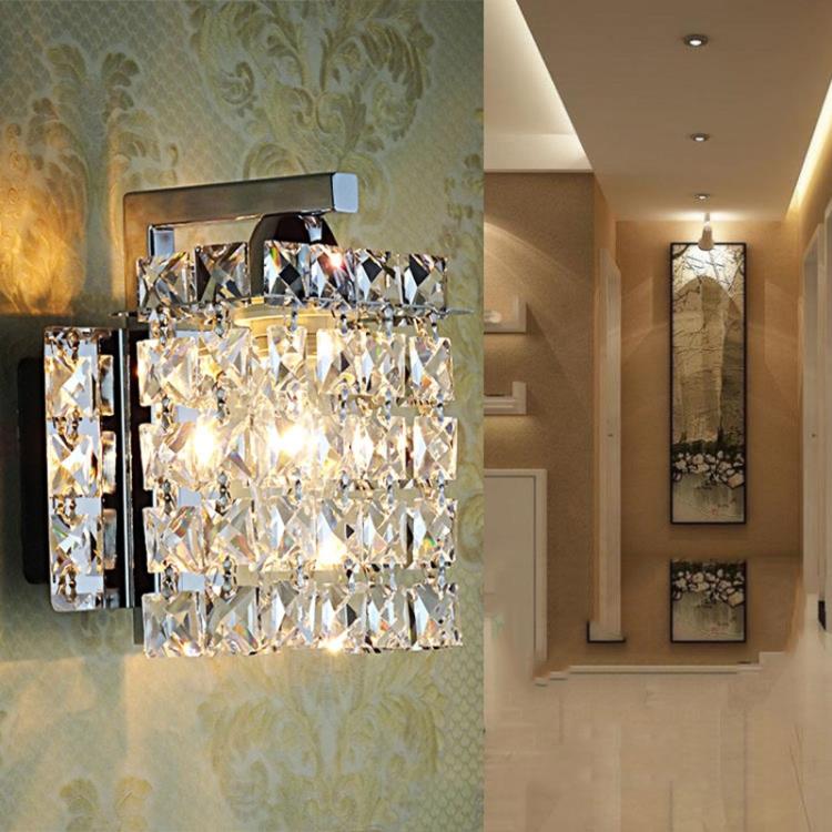 Crystal wall lamp with faceted front panel and black metal mounting on chrome back
