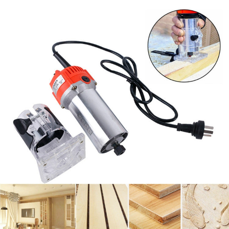 Red and gray electric trimming engraving machine with power cord, shown on wood projects