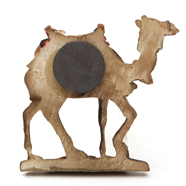 Camel refrigerator magnet silhouette with dark circular detail and light wood base