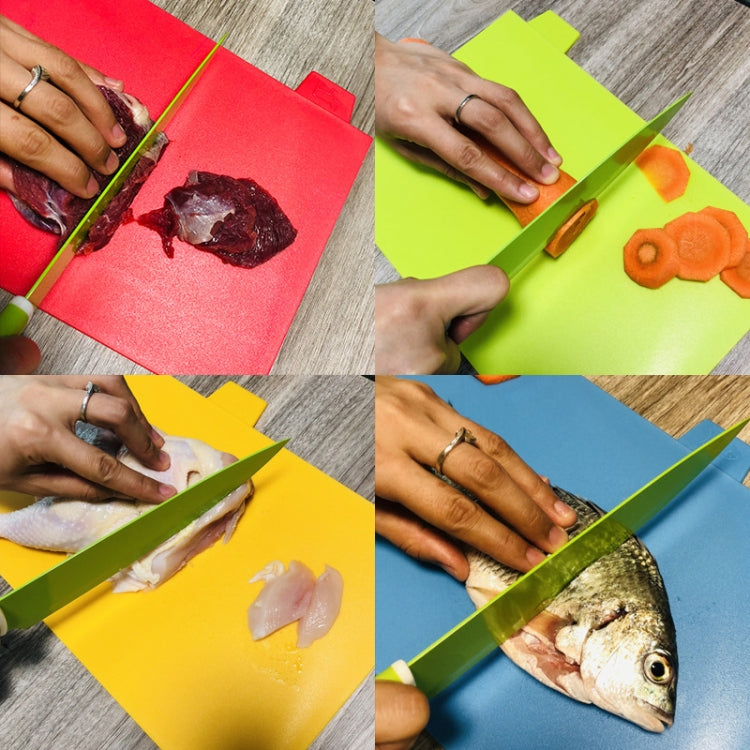 Colorful plastic cutting boards set laid out: red, green, yellow, and blue squares