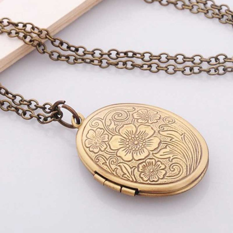 Antique bronze oval locket necklace with engraved floral embossing and link chain