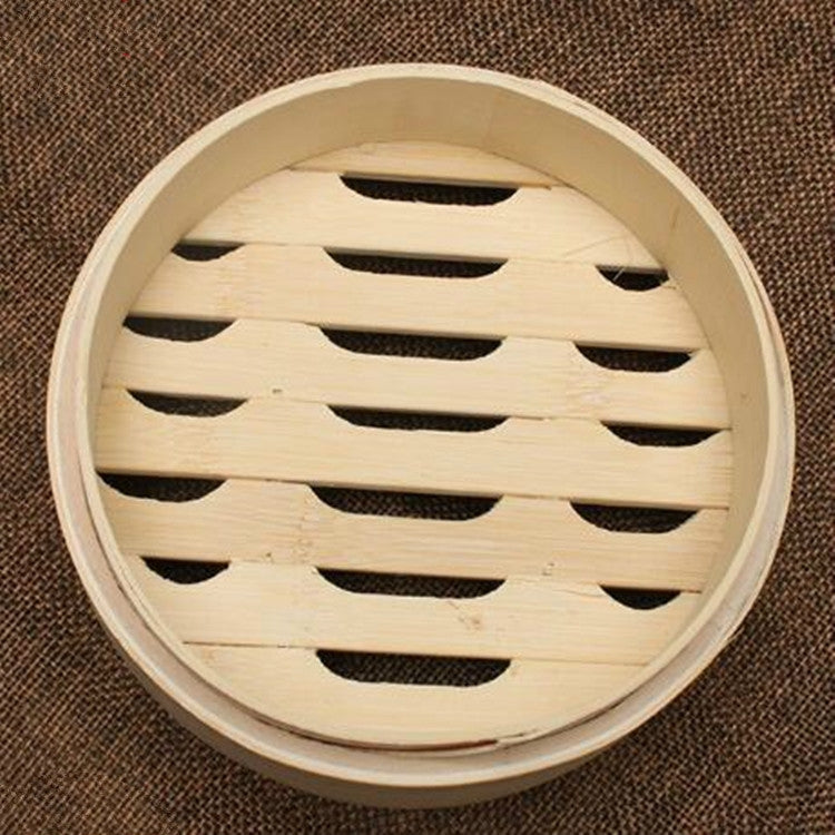 Round bamboo steamer basket with curved rim and slatted steam vents, top view