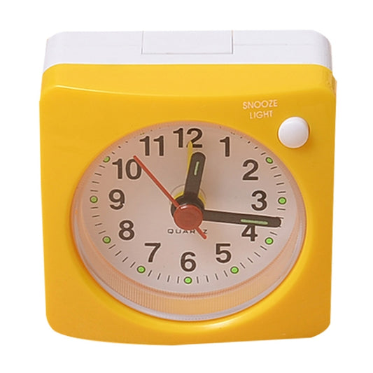 Yellow bedside alarm clock with light, snooze button, analog quartz dial