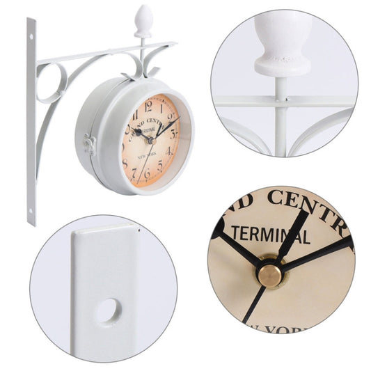 White double-sided wall clock showing round front dial and plain back cover