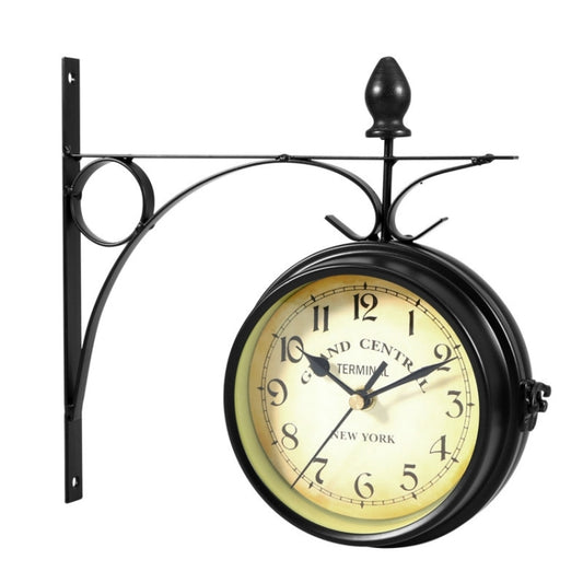Black wrought-iron wall clock with round dial and curved metal frame, single face visible
