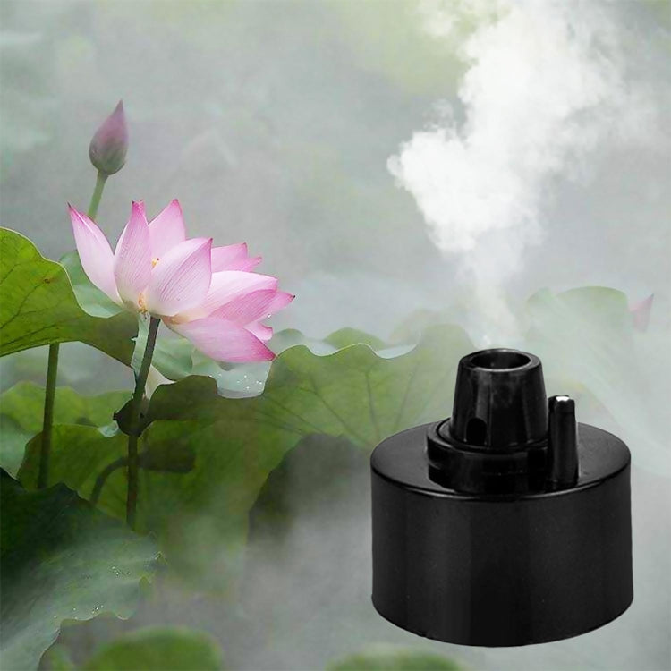 Black ultrasonic fish tank atomizer with visible mist plume
