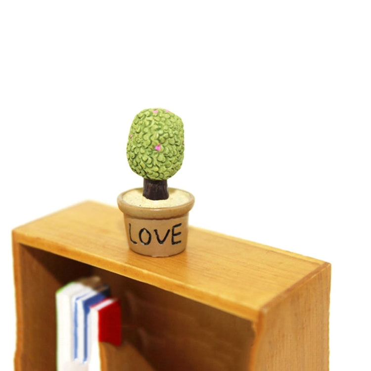 Mini potted artificial plant on dollhouse shelf, green plant in beige "LOVE" pot