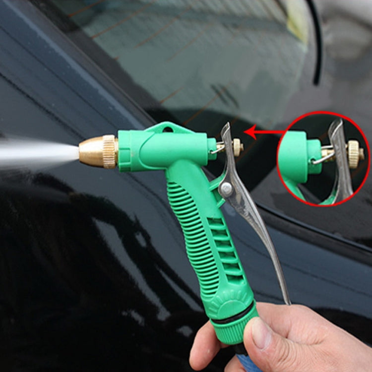 Handheld adjustable spray nozzle directing a water jet onto a car