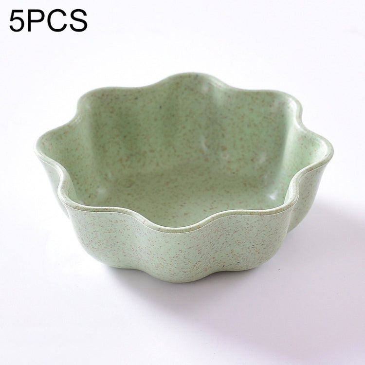 Green plum-shaped condiment dish with scalloped rim and shallow serving bowl