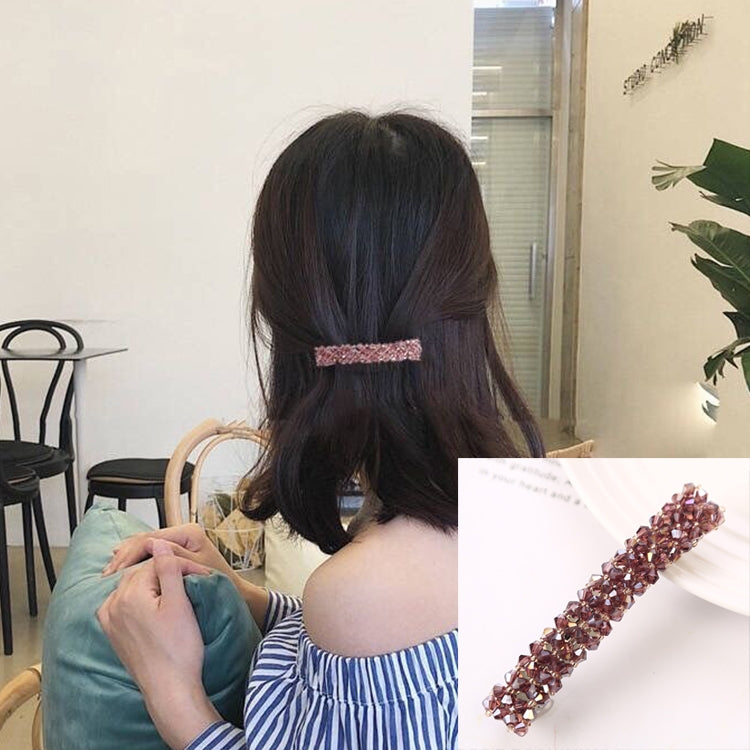 Girls rhinestone elastic hair clip, pink crystal bar on dark hair