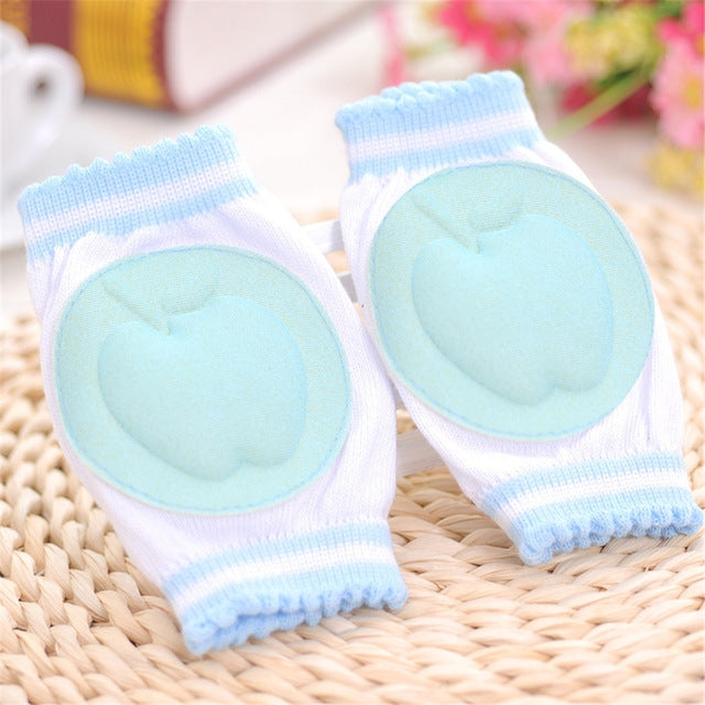 Sky blue breathable anti-slip baby knee pads with round molded cushion and ribbed cuffs