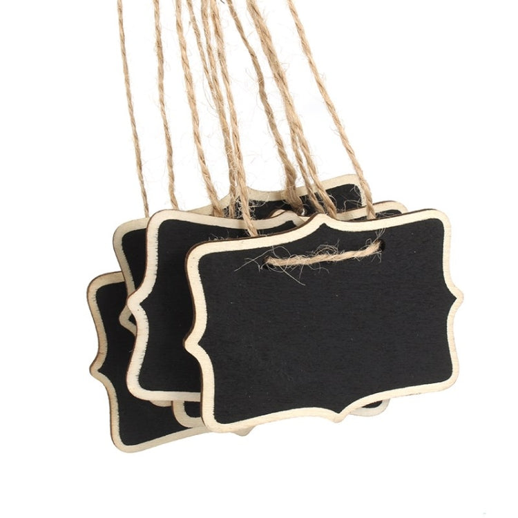 Close-up of mini black message board with scalloped wood frame and jute string