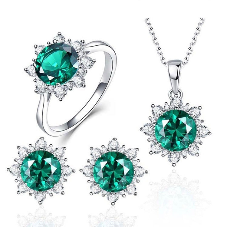 Jewelry set with green oval gemstone ring, pendant necklace, and stud earrings in silver tone.