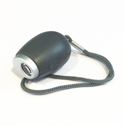 Grey mini projector alarm clock with hanging rope and lens on the front
