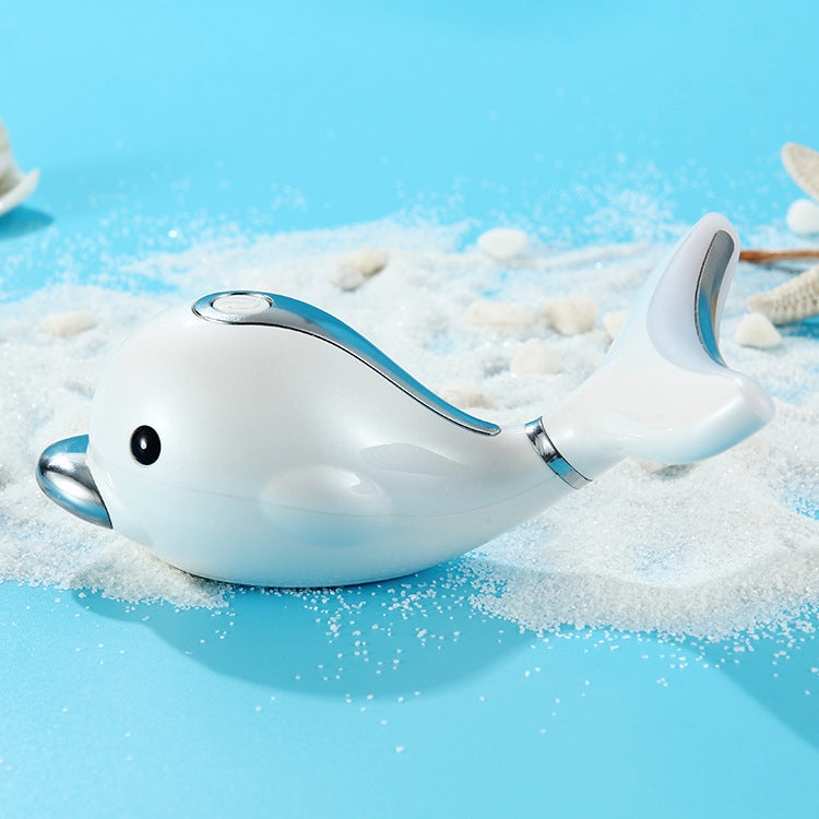 White dolphin handheld massager with LED head resting in a water-filled bath