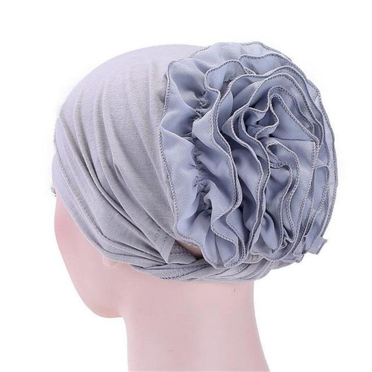 Light blue chiffon turban hat with large layered rosette flower