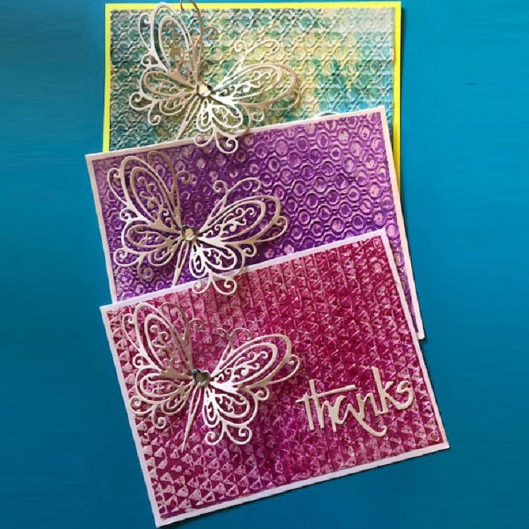 Multiple layered cards featuring an ornate butterfly stencil in light outline
