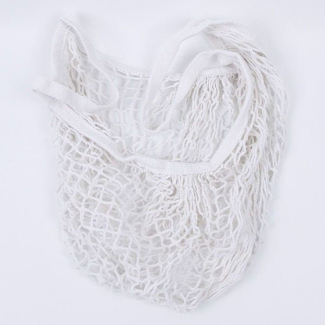 White mesh tote bag with long handles and open woven net design
