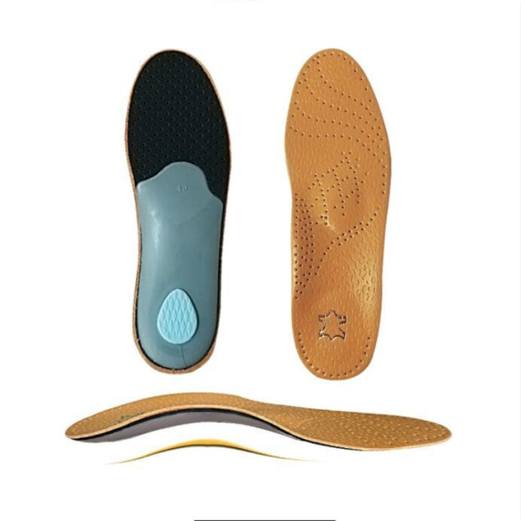 Arch support insoles with tan top perforations and dark underside with blue insert