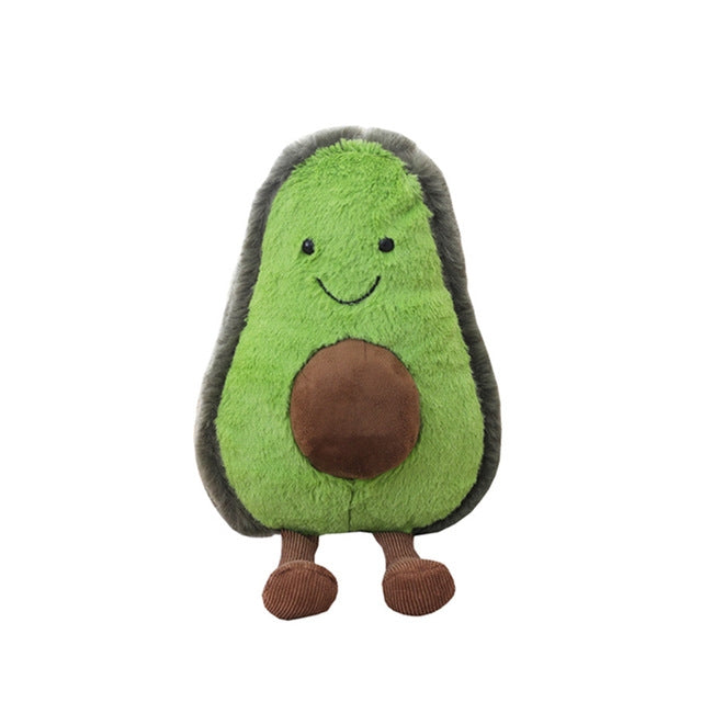 Green avocado plush pillow toy with brown center, stitched smile, and small brown feet