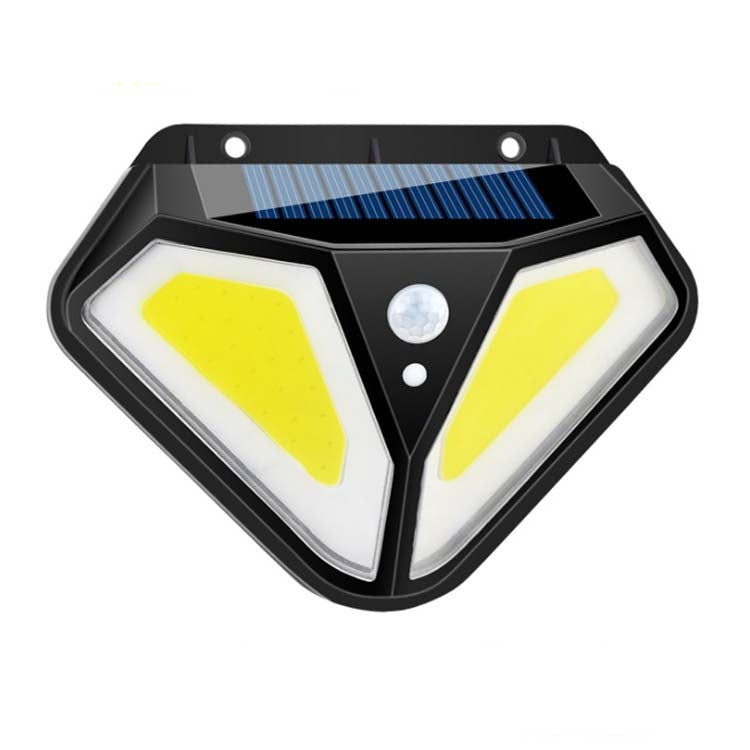Solar wall light close-up with solar panel top, yellow LEDs, and center motion sensor