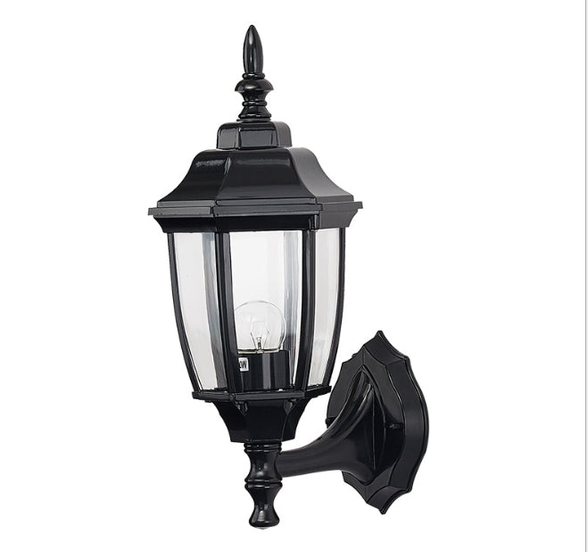 Black outdoor wall lantern light with clear glass panels and wall-mounted bracket