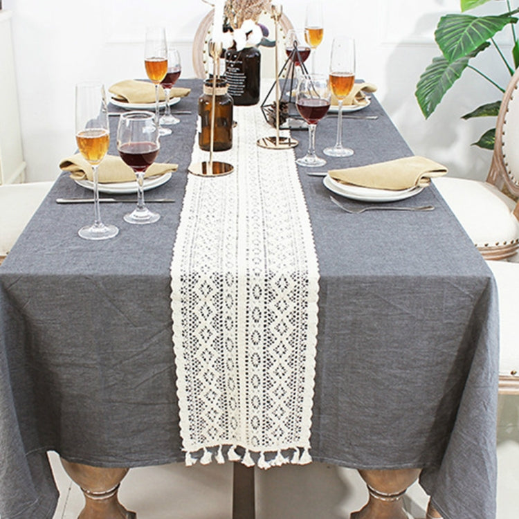 Crochet lace table runner cover with floral pattern and white tassel trim