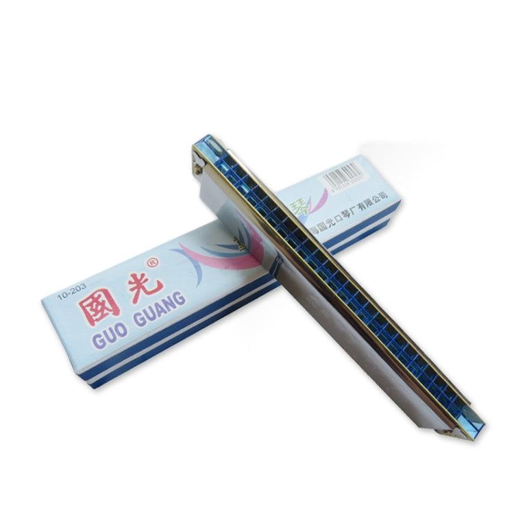 24-hole harmonica with blue grid, silver body and beige label package